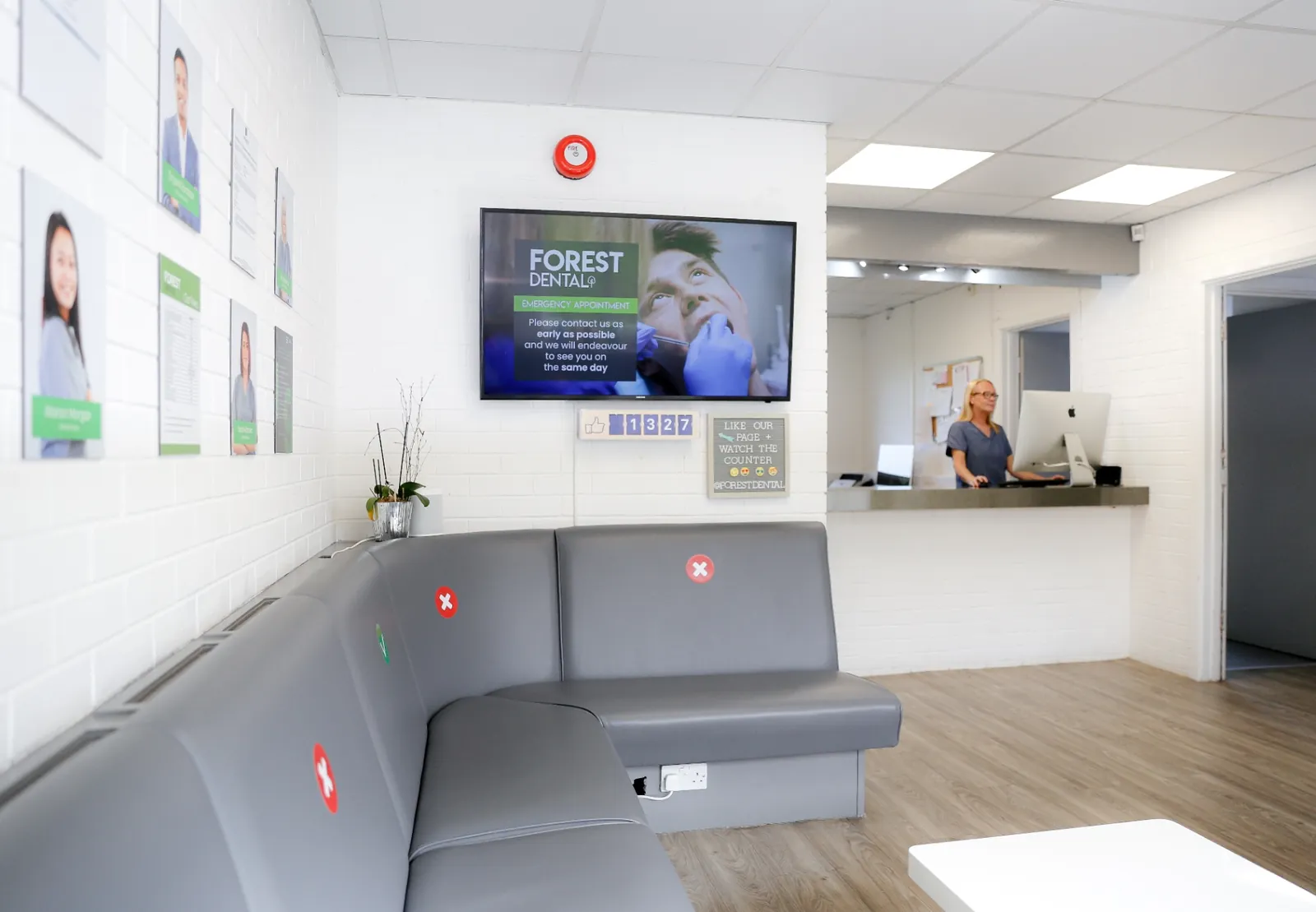 Forest Dental reception — same-day emergency screen and welcoming front desk