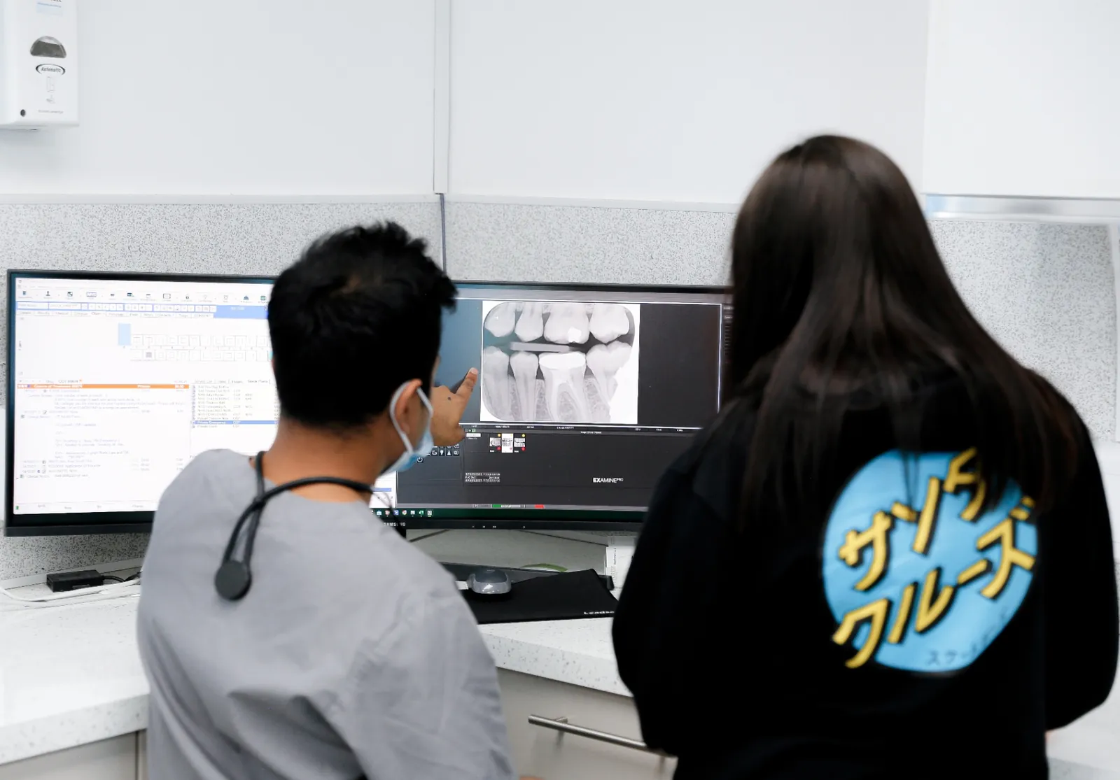 A Forest Dental clinician explaining an x-ray to a patient